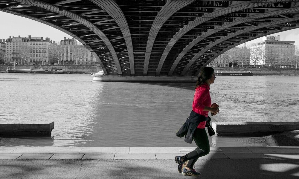 A woman jogging doing cardio exercise